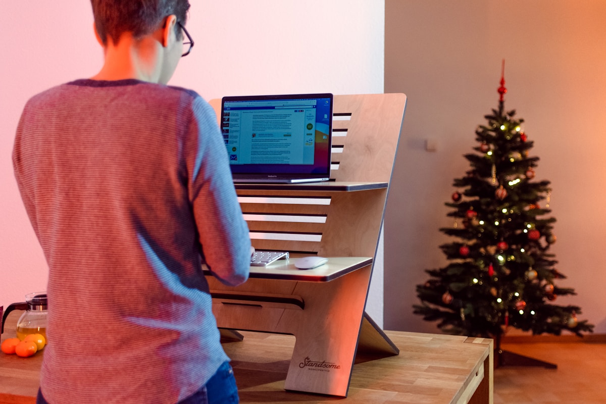 Person standing at desk — where anti-fatigue mats make a real difference