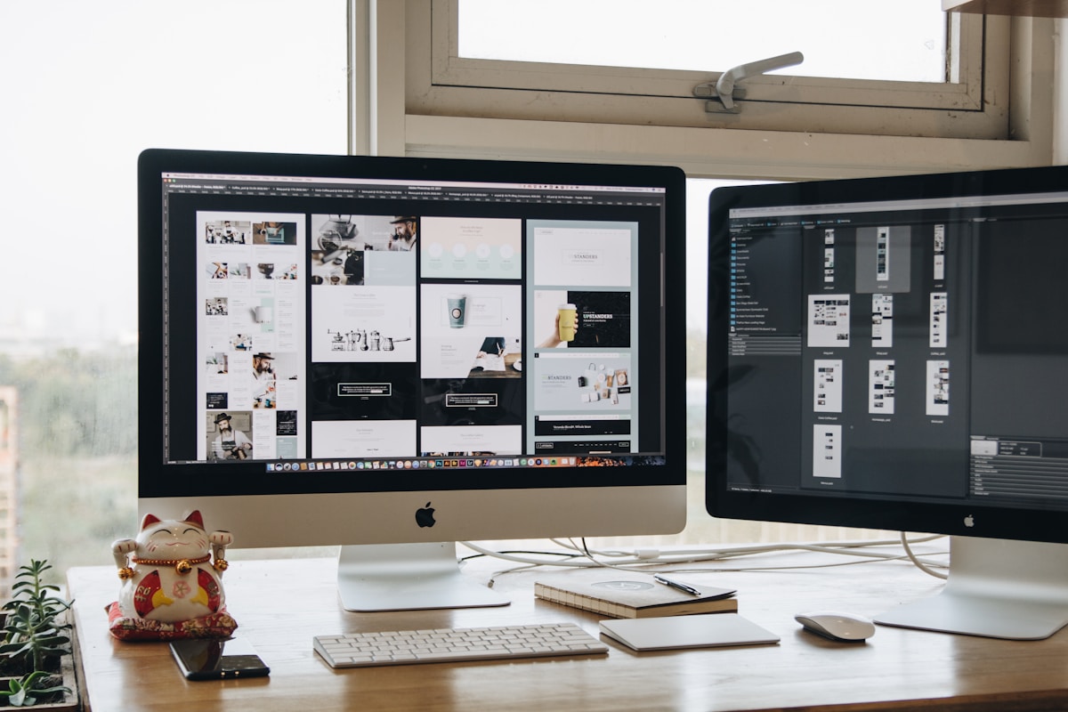 Dual screen desk setup — monitor and chair positioning matters for tall users